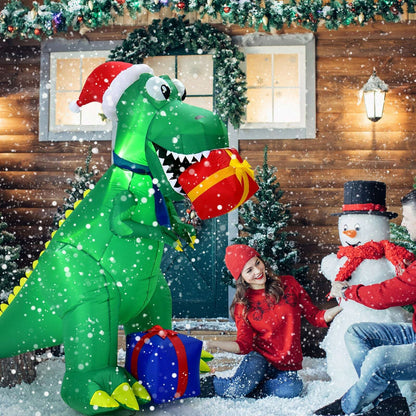 Green Christmas inflatable dinosaur holding a gift, shown with holiday decorations