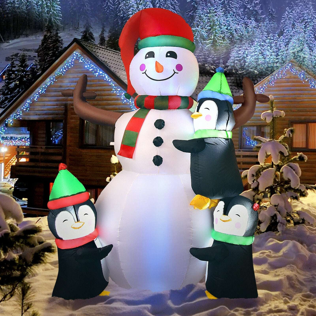 Inflatable snowman and three penguins, shown as a full holiday display