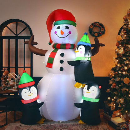 Inflatable snowman with three penguins, with the figures arranged around its body