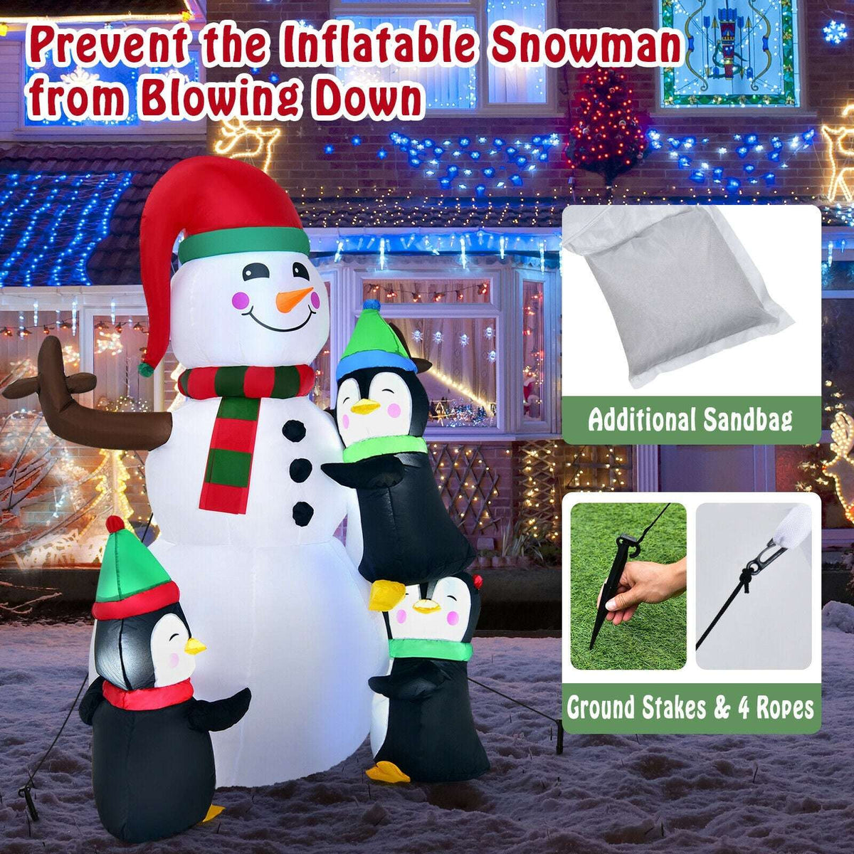 Inflatable snowman with three penguins, ground stakes, ropes, and a sandbag