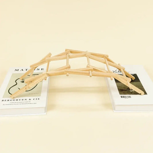 Wooden DIY bridge kit frame with triangular supports and planks