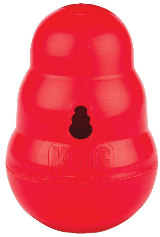 Red KONG wobbler treat-dispensing dog toy with central kibble hole and KONG logo