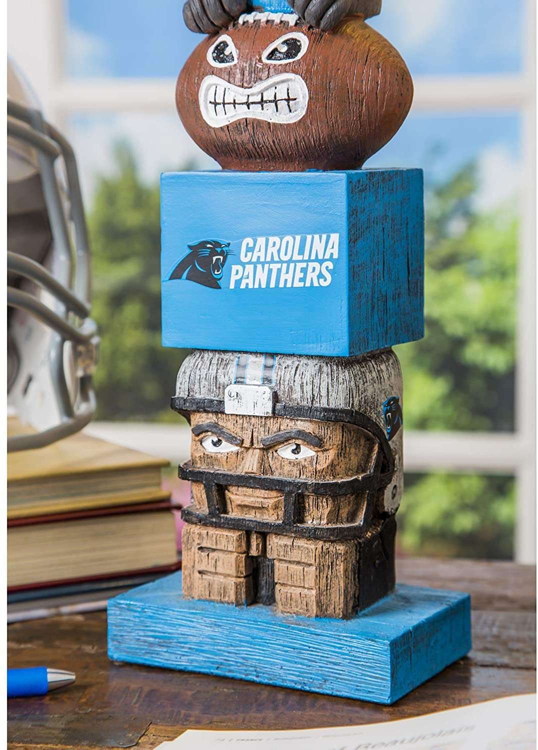Carolina Panthers tiki totem garden statue showing skull face and stacked brick blocks