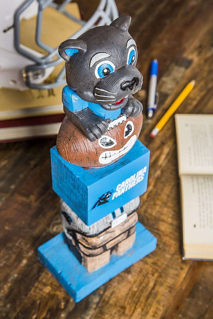 Carolina Panthers tiki totem garden statue close-up of cat and skull faces on blue block