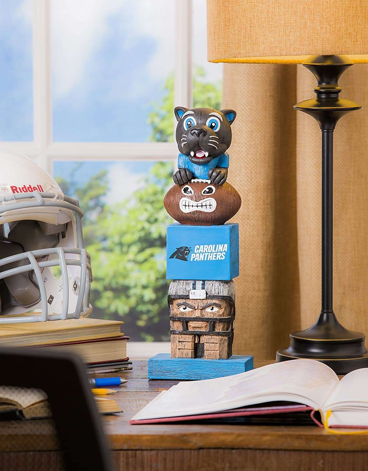 Carolina Panthers tiki totem garden statue standing with stacked faces on a blue cube base