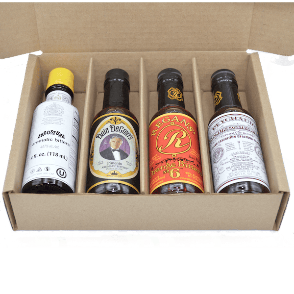 Opened Cocktailier bitters gift set with four bottles in a cardboard tray