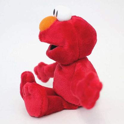 Side view of seated Elmo plush beanbag toy