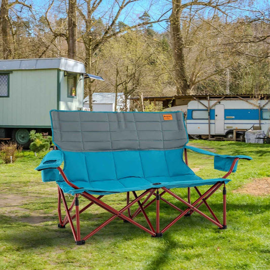 Blue and gray folding camping loveseat chair with padded back, armrests, and X-frame base