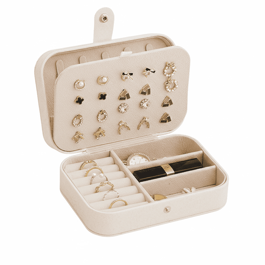 Small portable jewelry box with open organizer tray and assorted earring and ring compartments