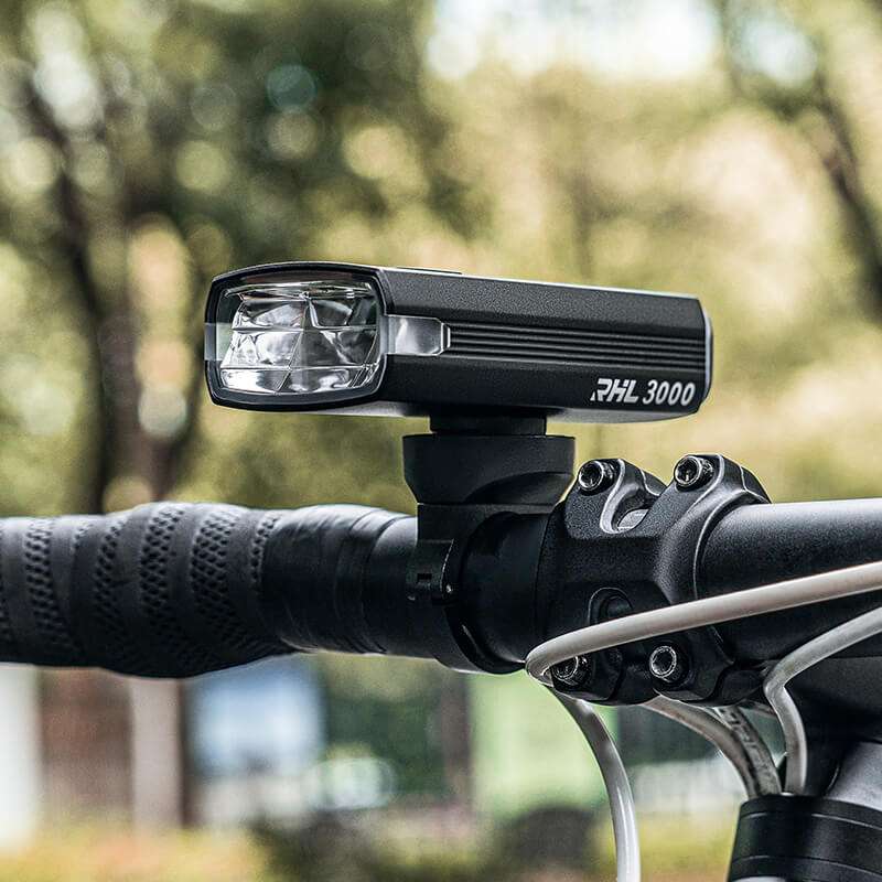 ROCKBROS black bicycle headlight with front lens, mounted on handlebar bracket