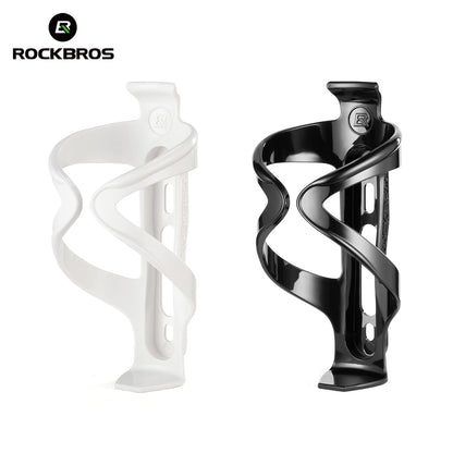 Bicycle water bottle cages, set with glossy white and glossy black plastic holders.