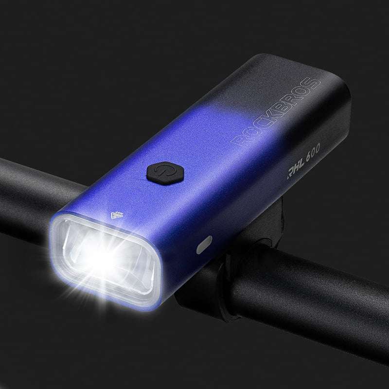 Blue front bike light with bright white square lens mounted on handlebar