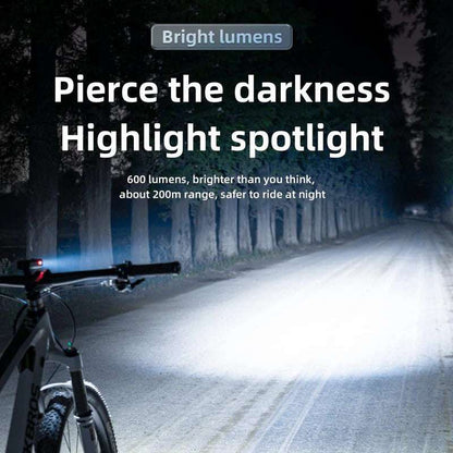 Front bike light emitting a strong white beam along the road from the handlebar