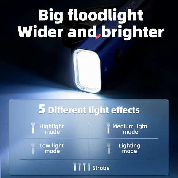 Front bike light with a square white lens, shining a wide bright beam