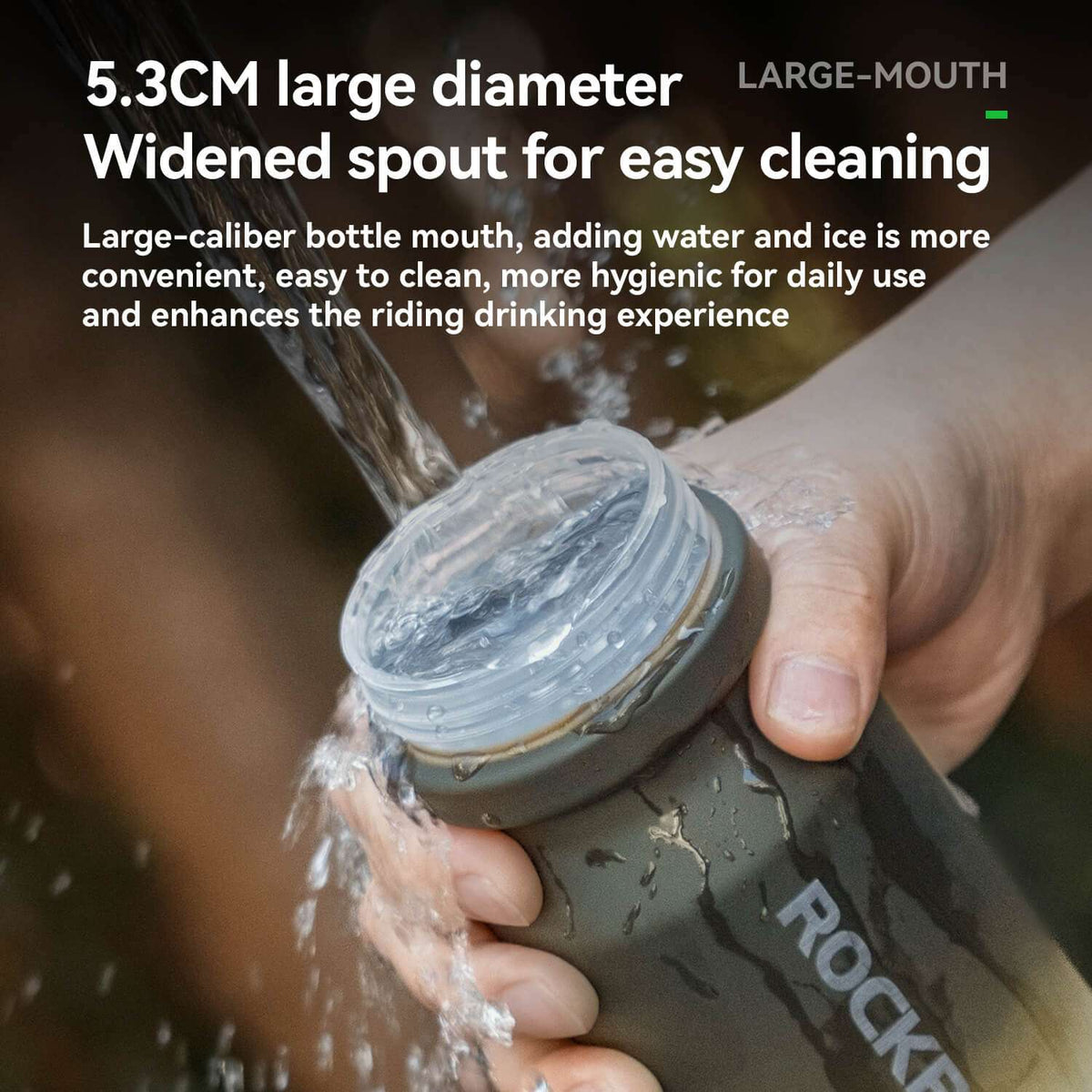Hand opening wide-mouth bike water bottle with black cap, ROCKBROS logo, water droplets