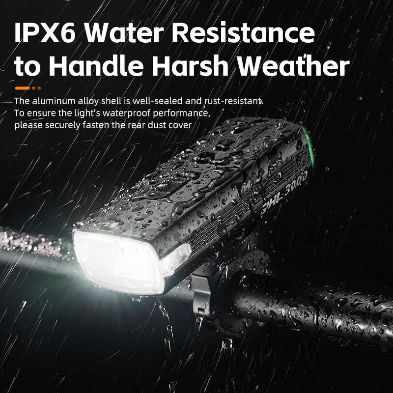 Waterproof-style bicycle headlight with front lens and raindrops on the dark housing