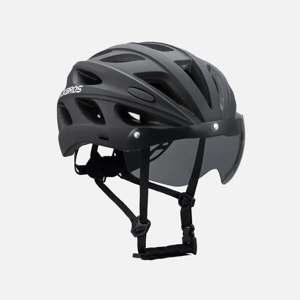 Dark bike helmet with full visor and goggles, front 3/4 view