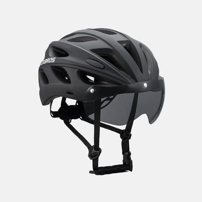 Dark bike helmet with full visor and goggles, front 3/4 view