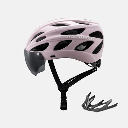 White bike helmet with black visor and adjustable chin strap, with included goggles accessory