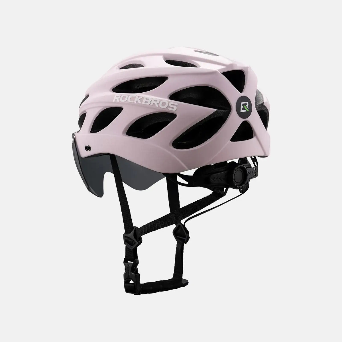 Bicycle helmet, light pink shell with vent openings and black chin strap