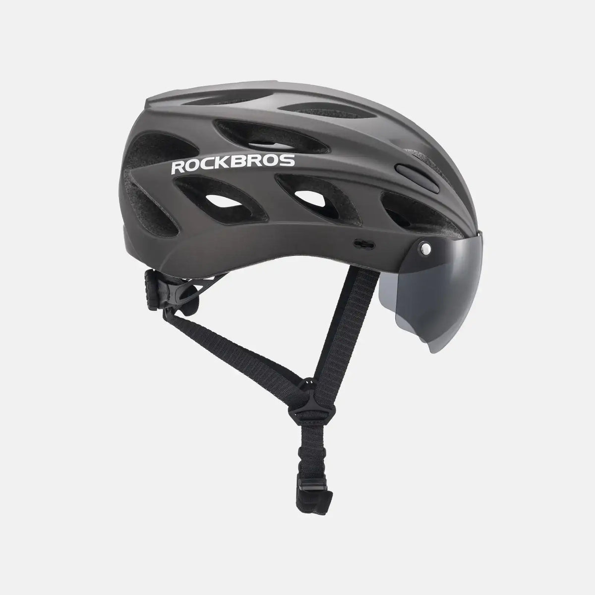 Dark gray bike helmet with visor and front goggle frame, includes adjustable chin strap