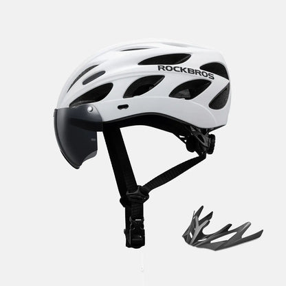 White bike helmet with clear visor and attached goggles, includes extra goggle piece