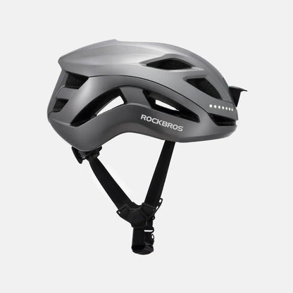 White ROCKBROS bike helmet with visor vents and adjustable chin straps