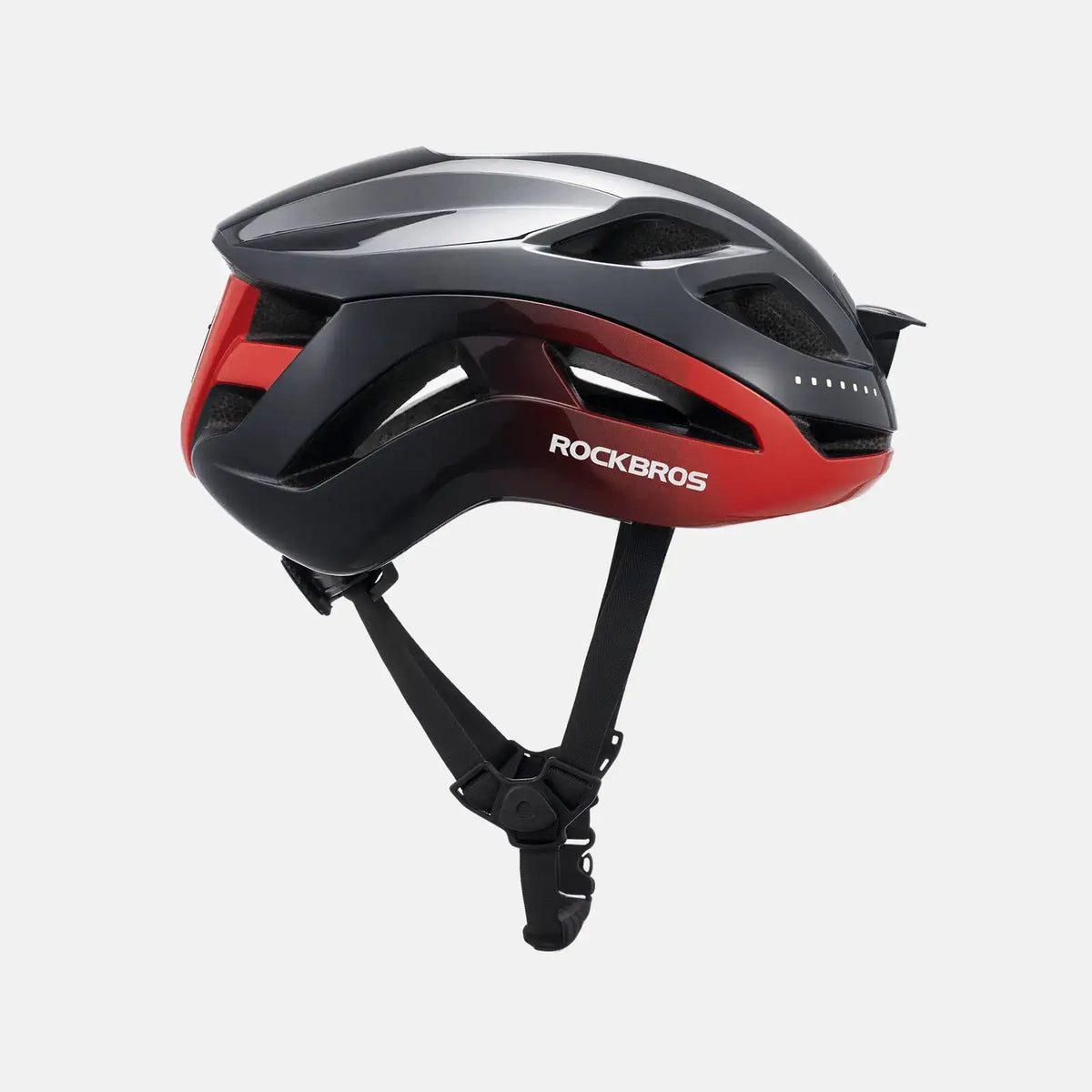 Red-accent bike helmet with glossy black shell and small side LED strip, angled view.