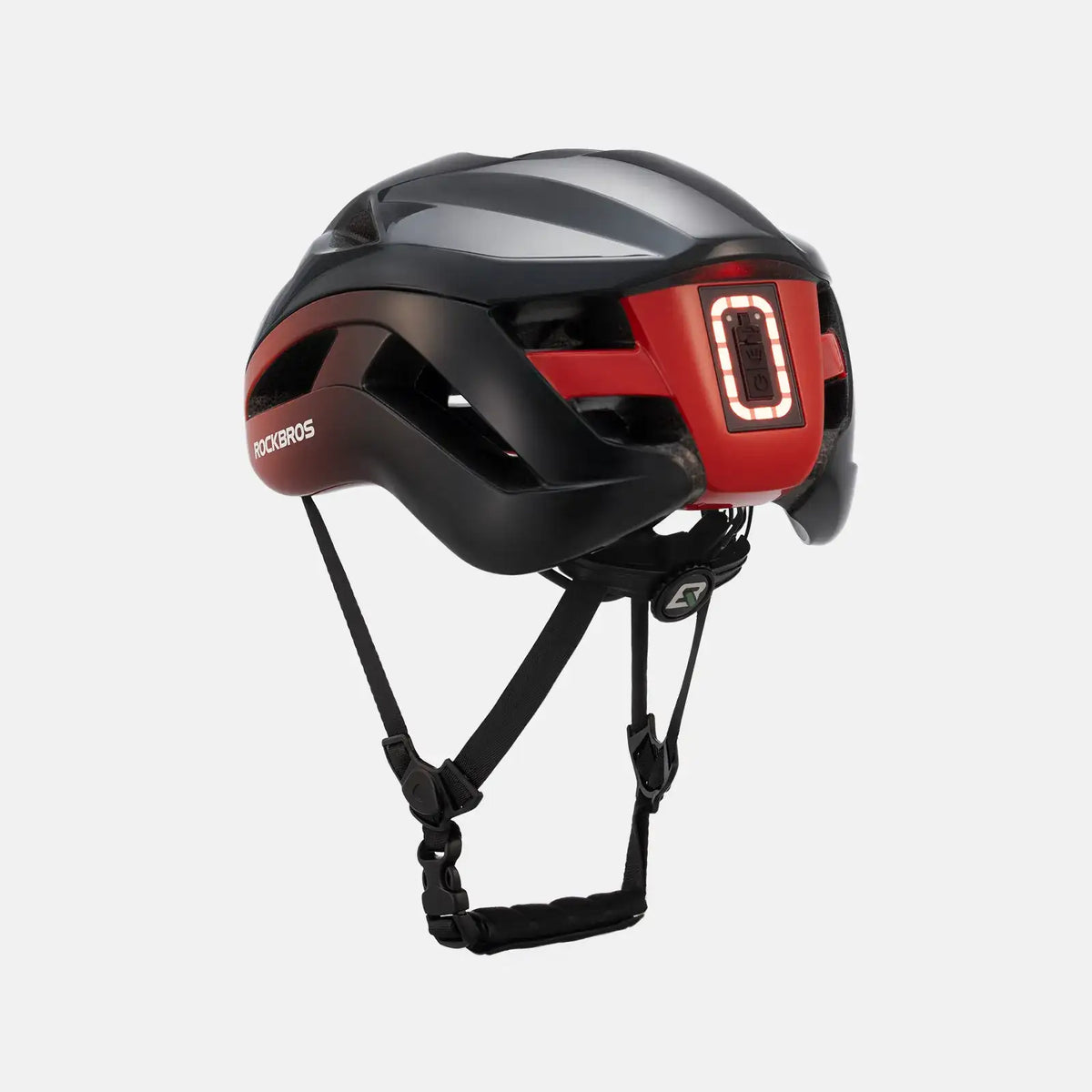Red-accent black bike helmet with rear red LED taillight and adjustable chin straps.