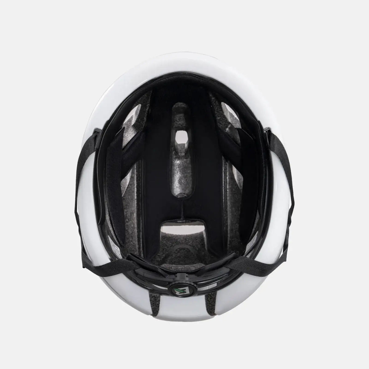 White bike helmet interior view with black padding and rear LED housing