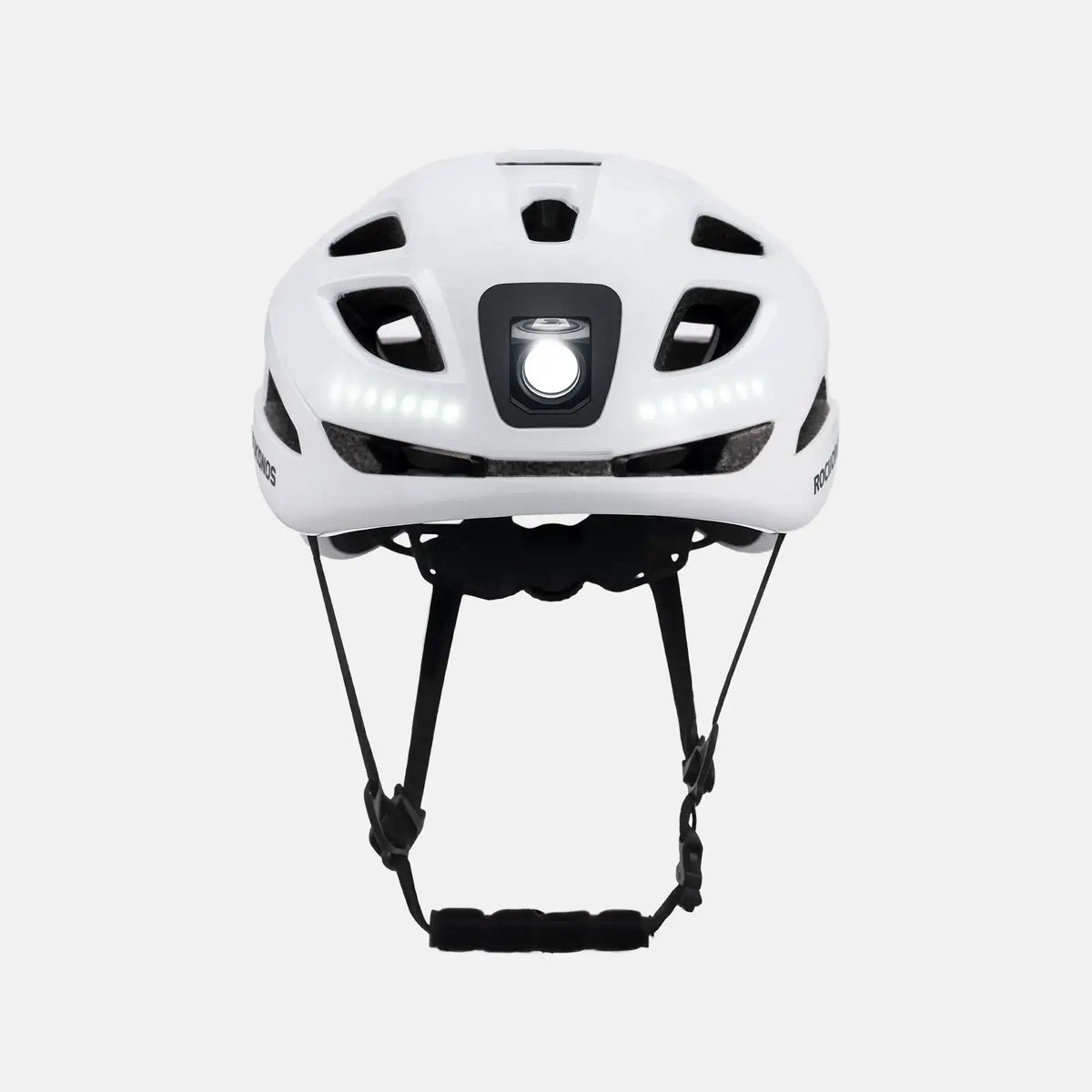 White bike helmet top view with central square LED module and padding