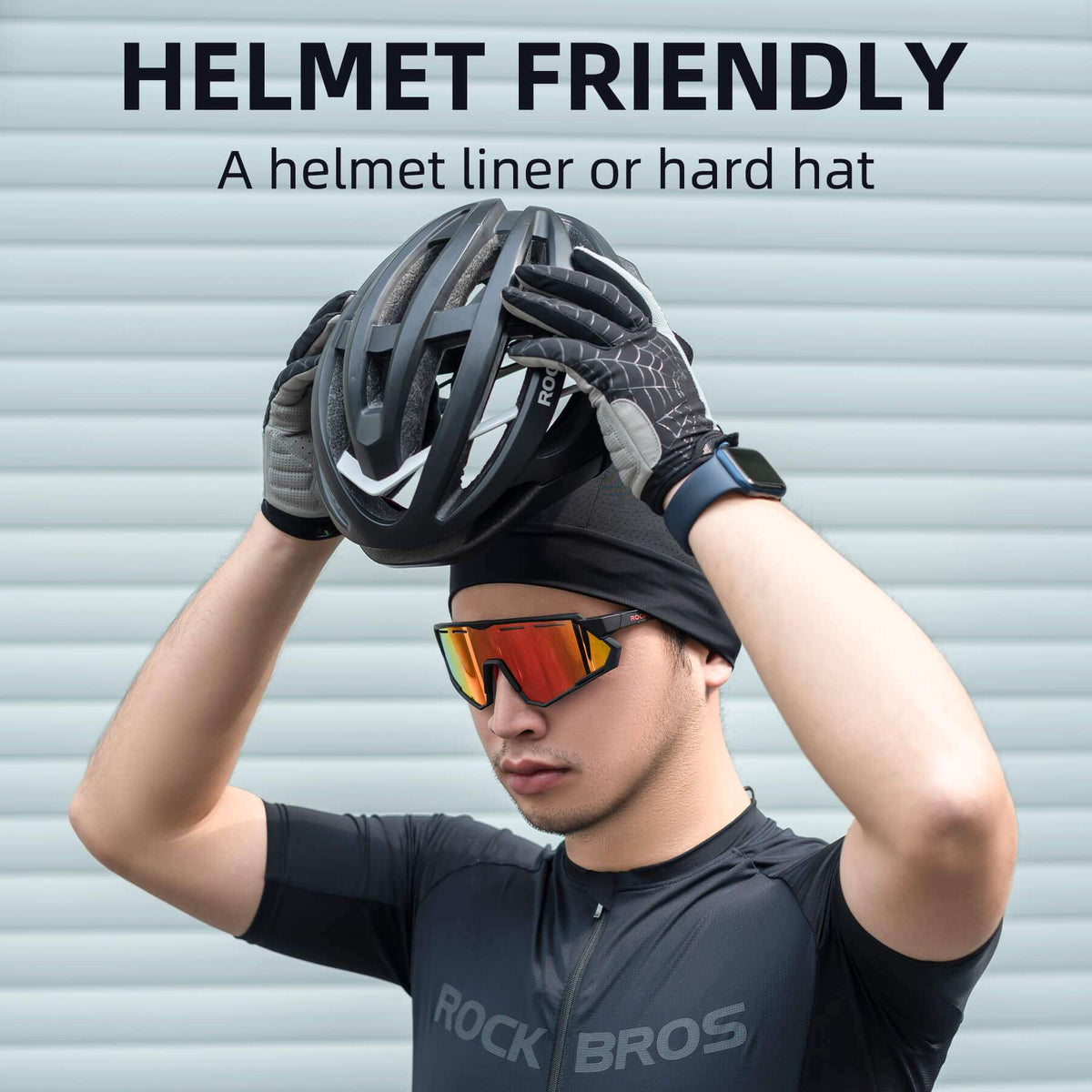 Black cooling helmet liner beanie worn under a bicycle helmet by a rider