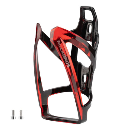 Red and black bike water bottle cage with cutout frame and side mounting holes.