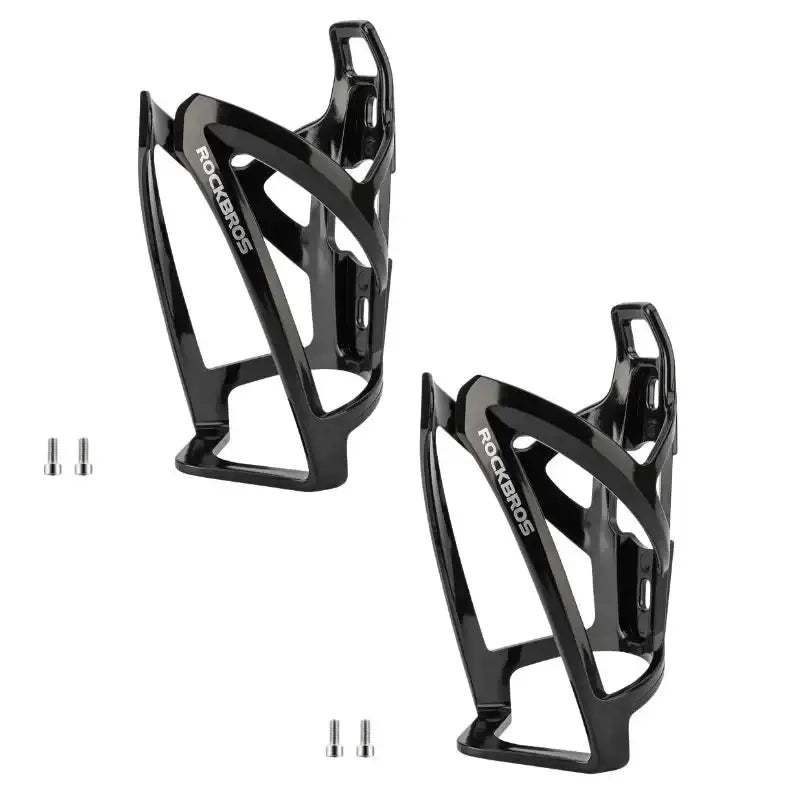 Pair of black bike water bottle cages with mounting holes and cutout sides.