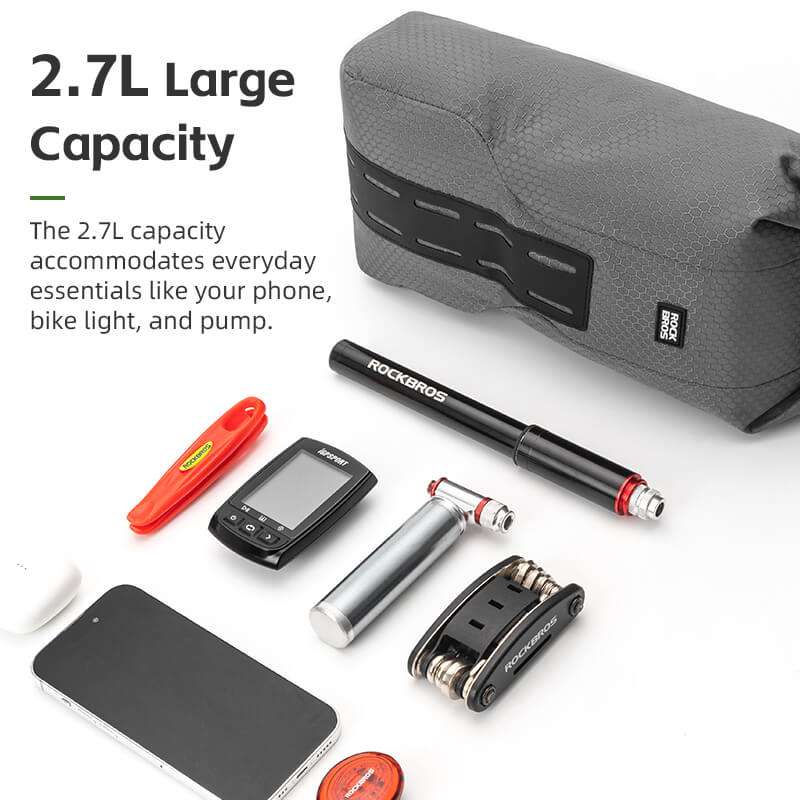 Gray roll-top front fork rack bag with front access panel and textured surface