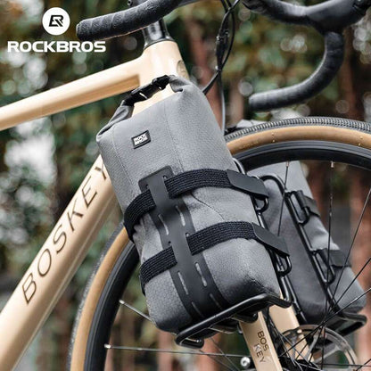 Gray water-resistant front fork rack bag mounted on bicycle fork with reinforced base