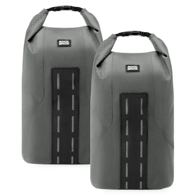 Two gray front fork rack bags with roll-top opening and black hook-and-loop straps