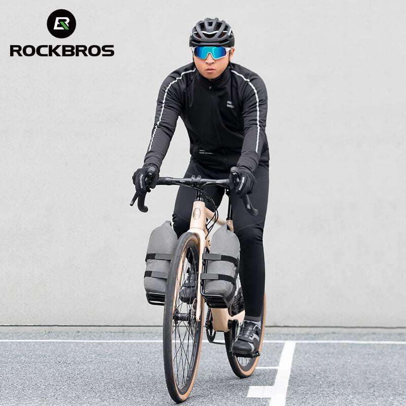 Gray front fork rack bag on bicycle front fork with secure strap mounting