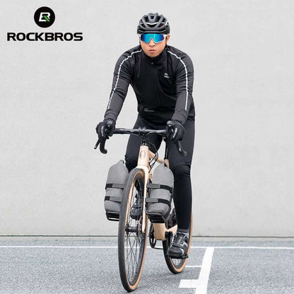 Gray front fork rack bag on bicycle front fork with secure strap mounting