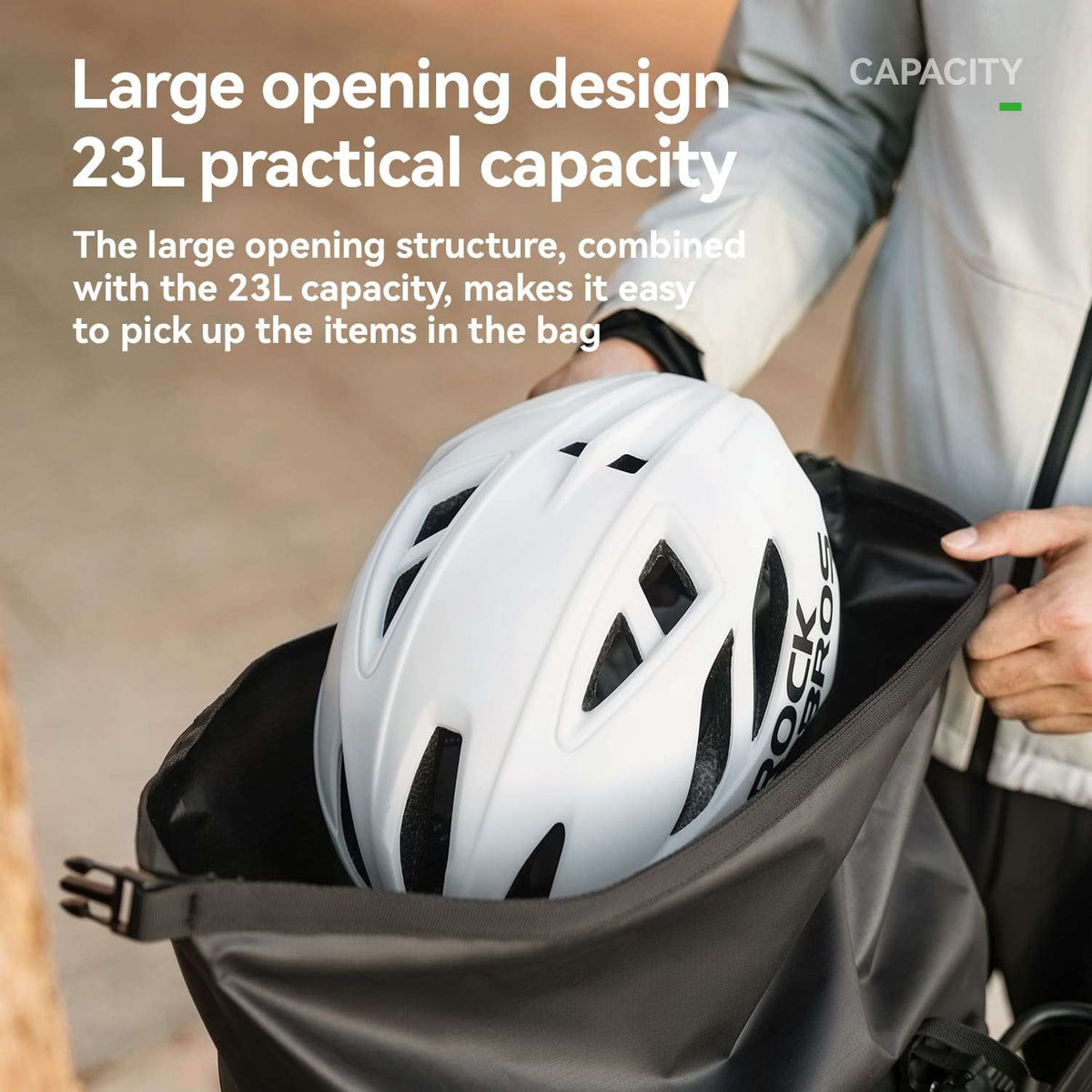 White waterproof rear rack bag with roll-top closure and front vertical handle