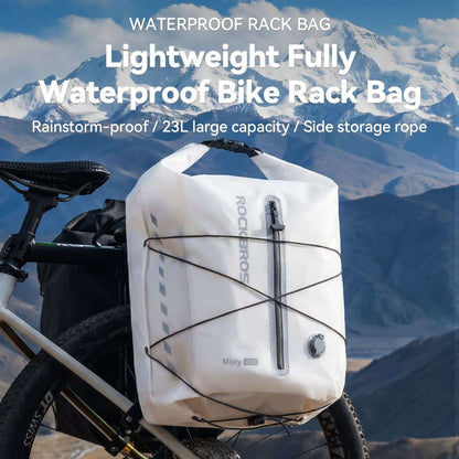 White waterproof rear rack bag with roll-top closure and front strap pattern