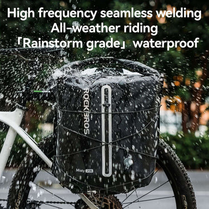 Black waterproof rear rack bag with roll-top closure and side webbing straps