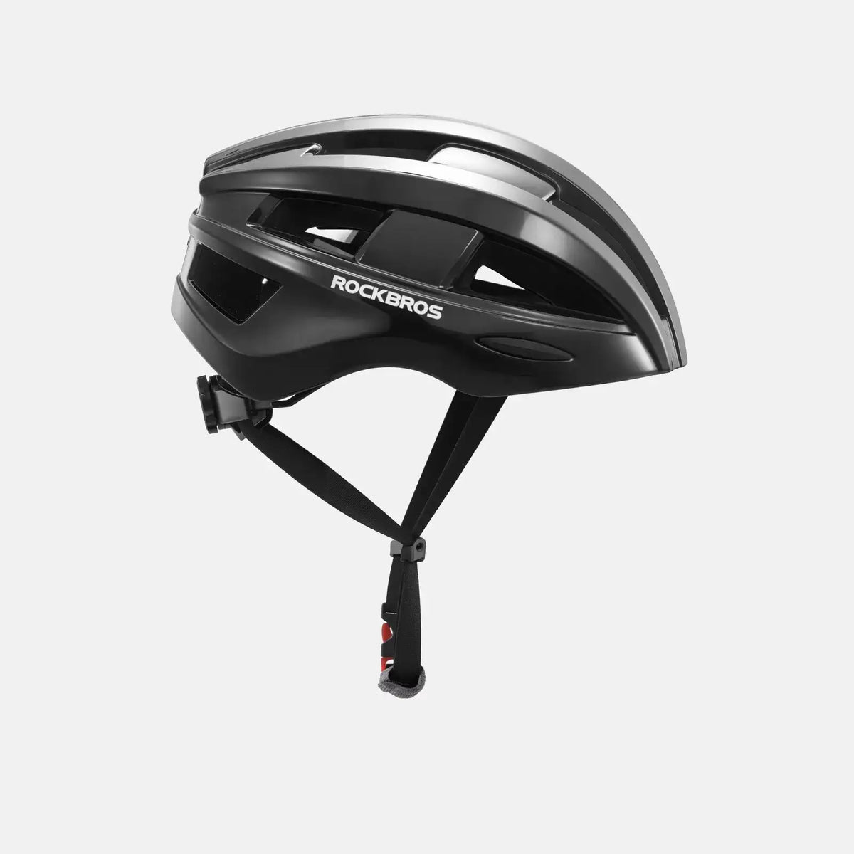 Black bike helmet, side view with vent panels and adjustable chin strap
