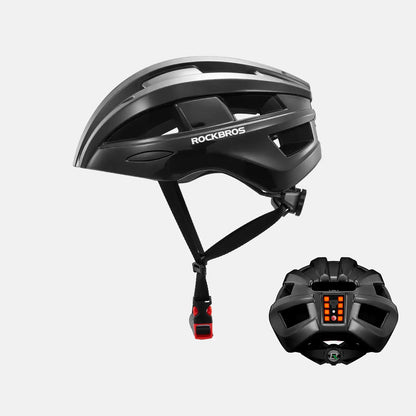 Black bike helmet with rear LED light glowing and chin strap