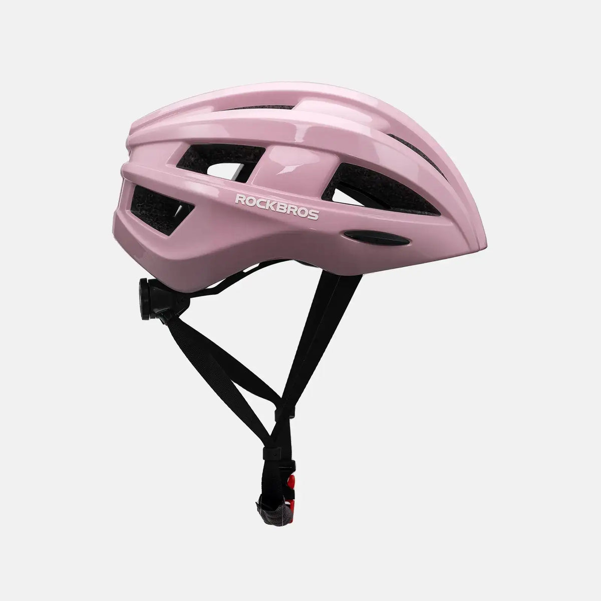 Pink bike helmet, side view with vent panels and black strap