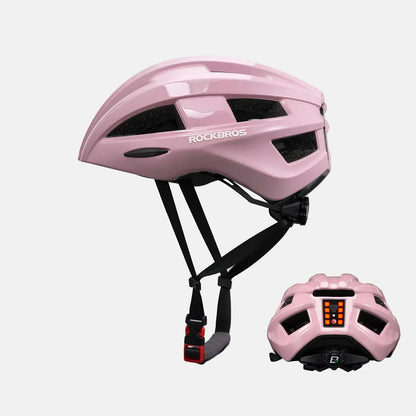 Pink bike helmet with rear LED light and adjustable chin straps