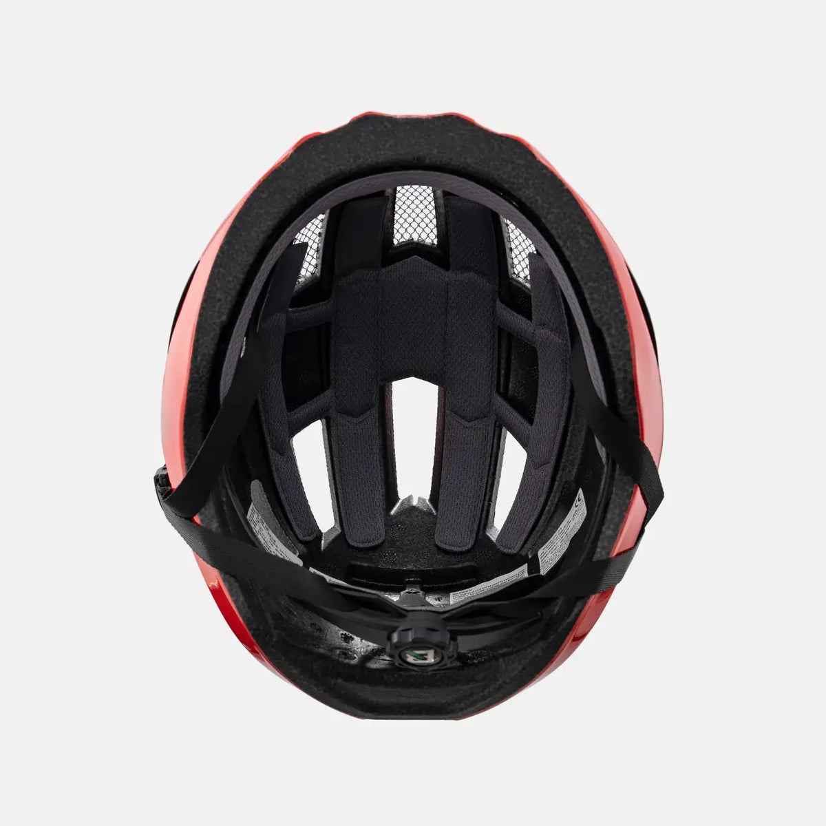 Red bike helmet interior with black padding and vent channels