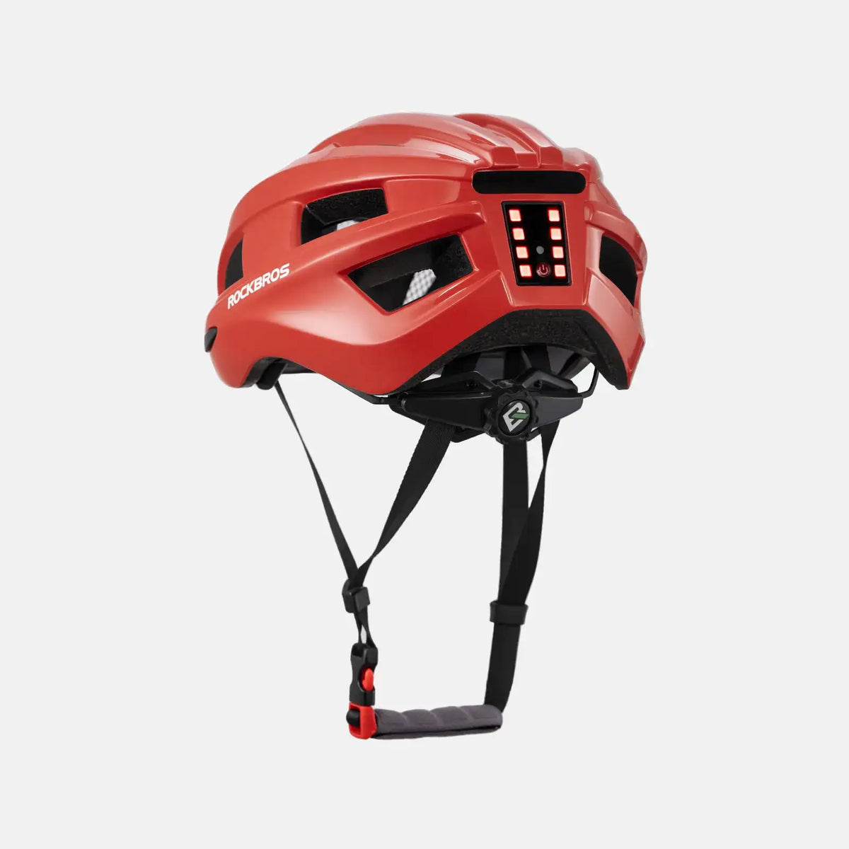 Red bike helmet angled view with rear LED light panel lit