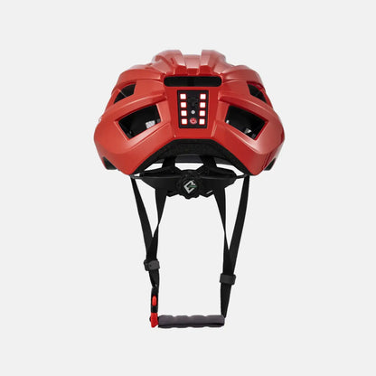 Red bike helmet with rear LED light, black straps, and vented shell