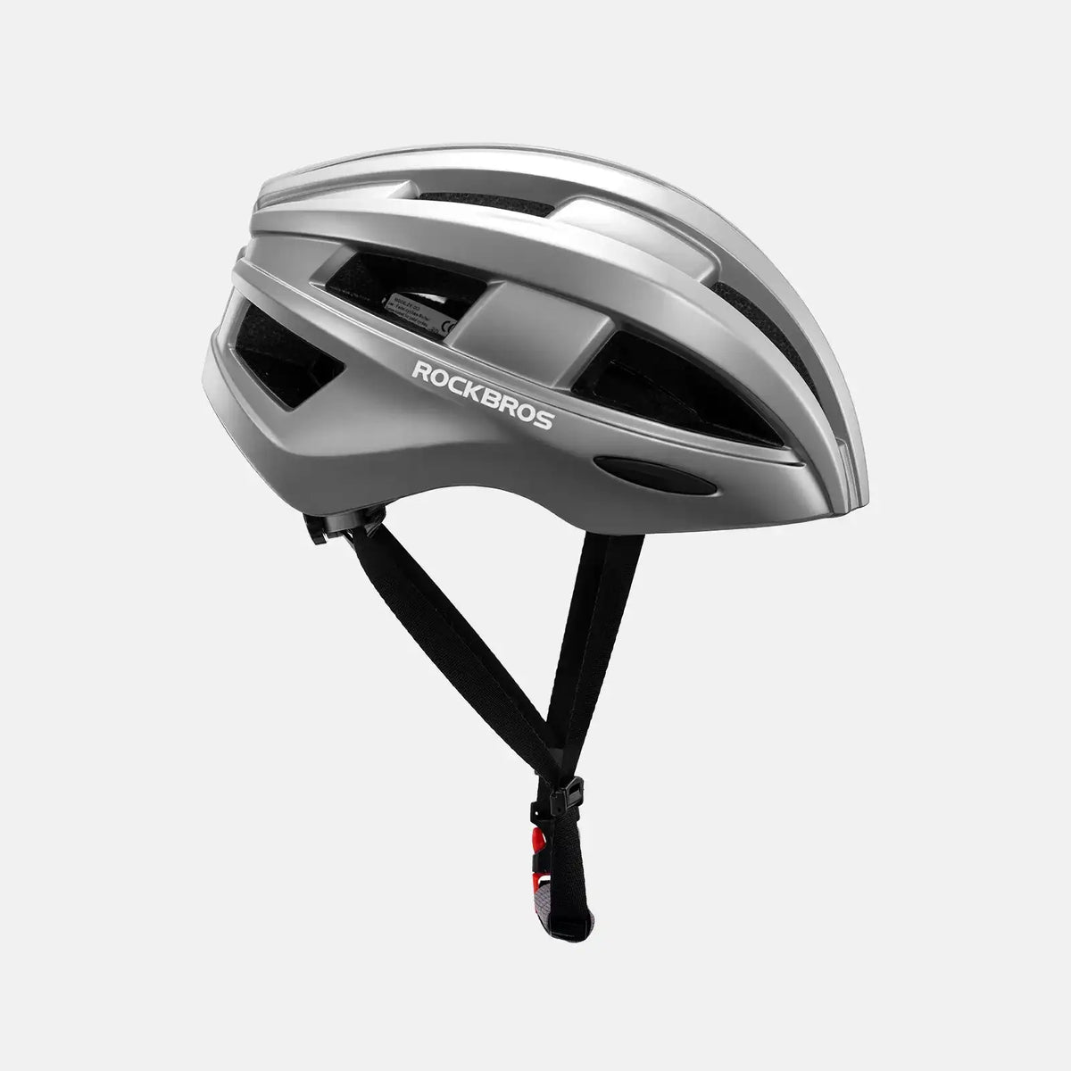 Silver bike helmet with rear LED light, black straps, and vented shell